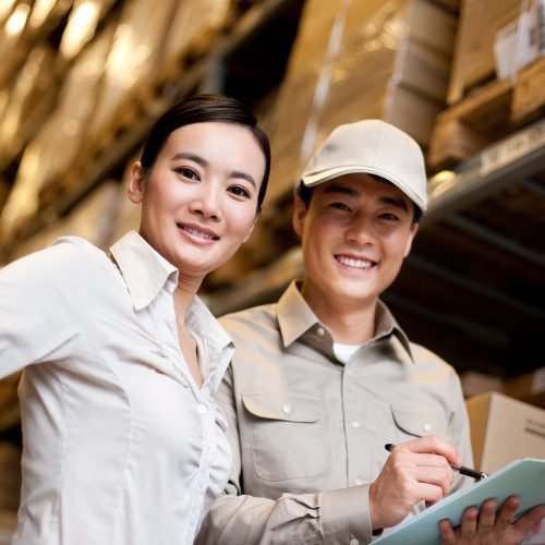 chinese-businesswoman-in-a-warehouse-with-worker-2023-11-27-04-54-36-utc